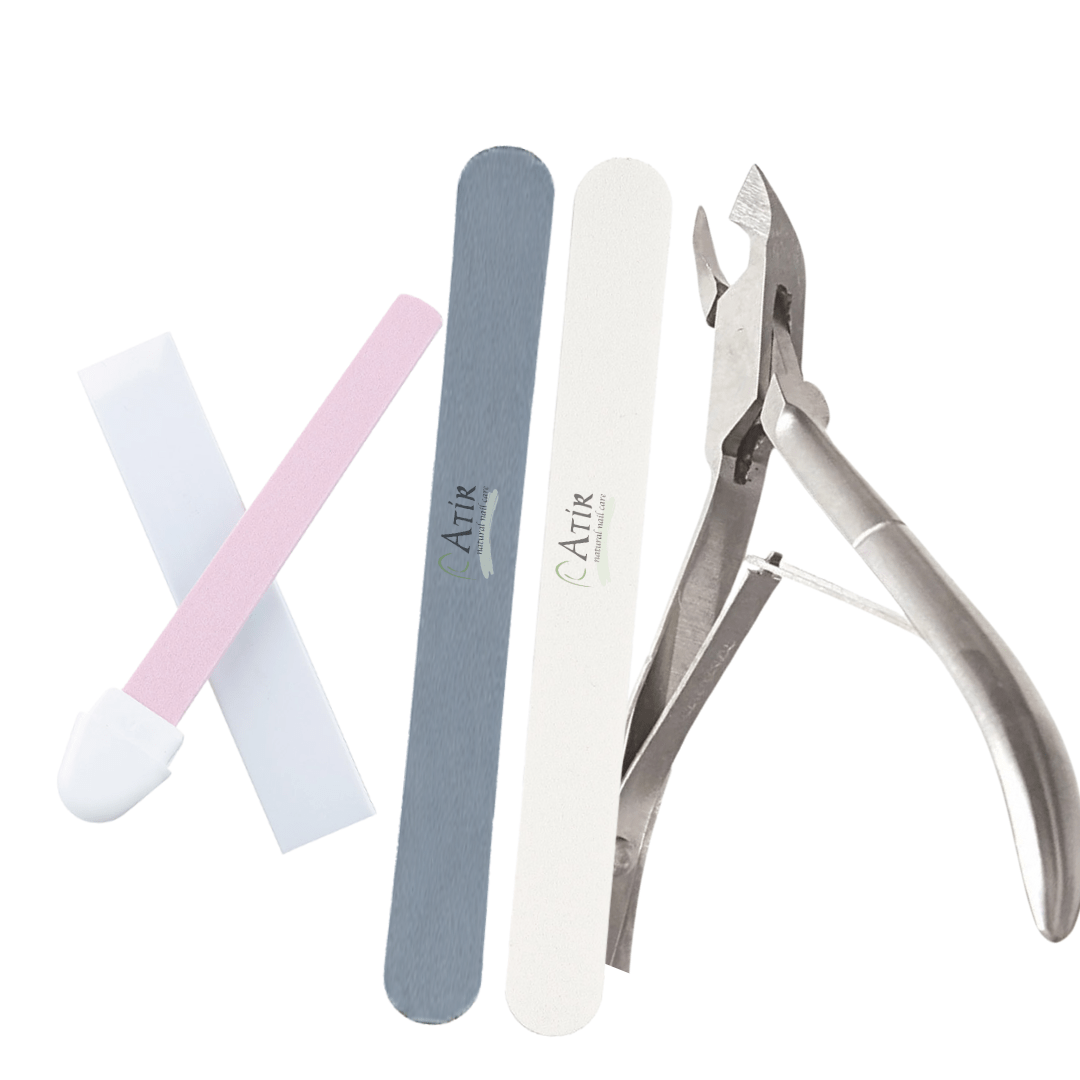 ATiR natural nail care tool kit including Polishing Stone, natural nail file, buffer, and cuticle nippers.