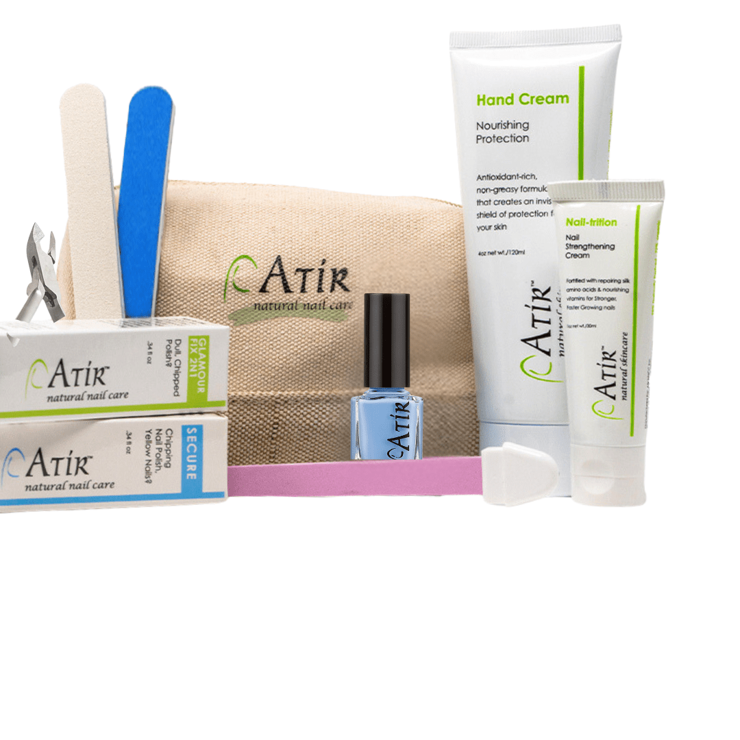 ATiR Deluxe Natural Nail Care Kit with non-toxic nail polish, base and top coats, Nail-Trition cuticle cream, hand cream, and professional nail tools for complete at-home manicure care.