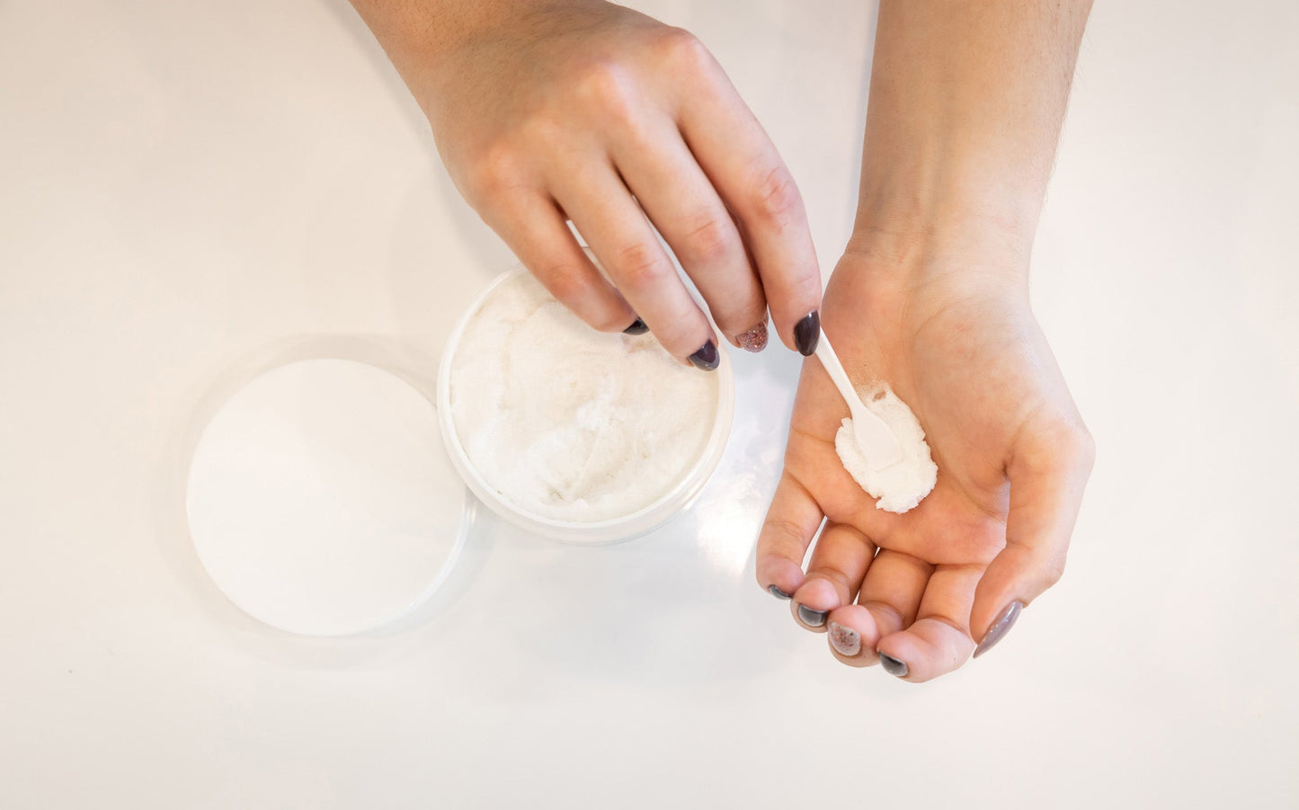 Shea Butter Sugar Scrub open jar and product on woman's hand
