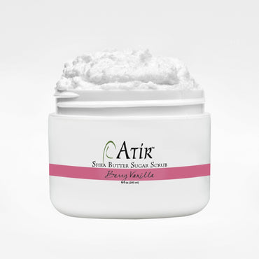 Open jar of Berry Vanilla ATiR Shea Butter Sugar Scrub with whipped white scrub billowing to the top