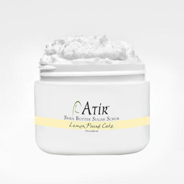 Open jar of Lemon Pound Cake ATiR Shea Butter Sugar Scrub with whipped white scrub billowing to the top